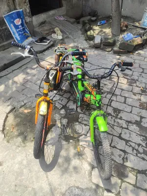 Green and Yellow Running 2 Bicycles