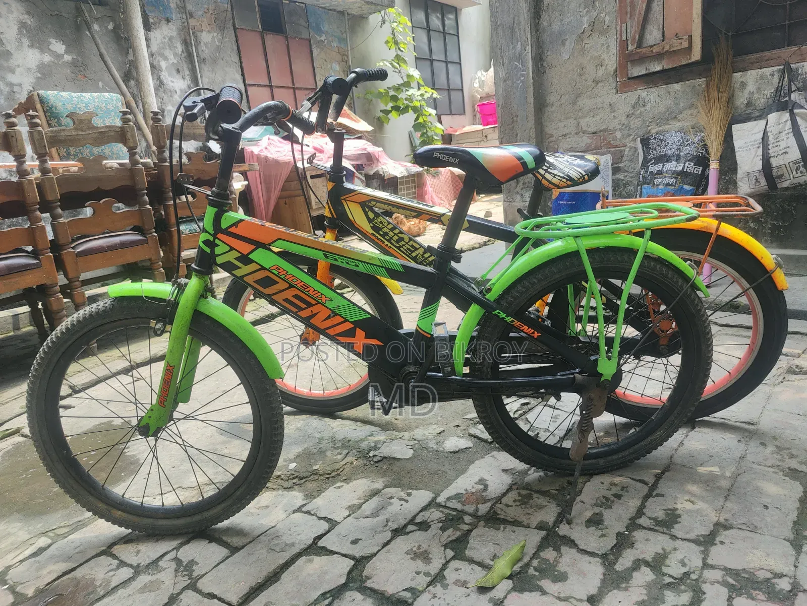 Green and Yellow Running 2 Bicycles