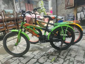Green and Yellow Running 2 Bicycles