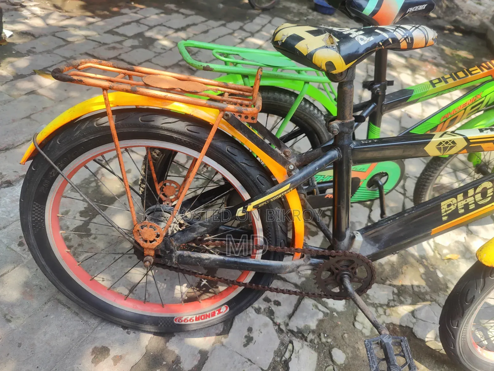 Green and Yellow Running 2 Bicycles