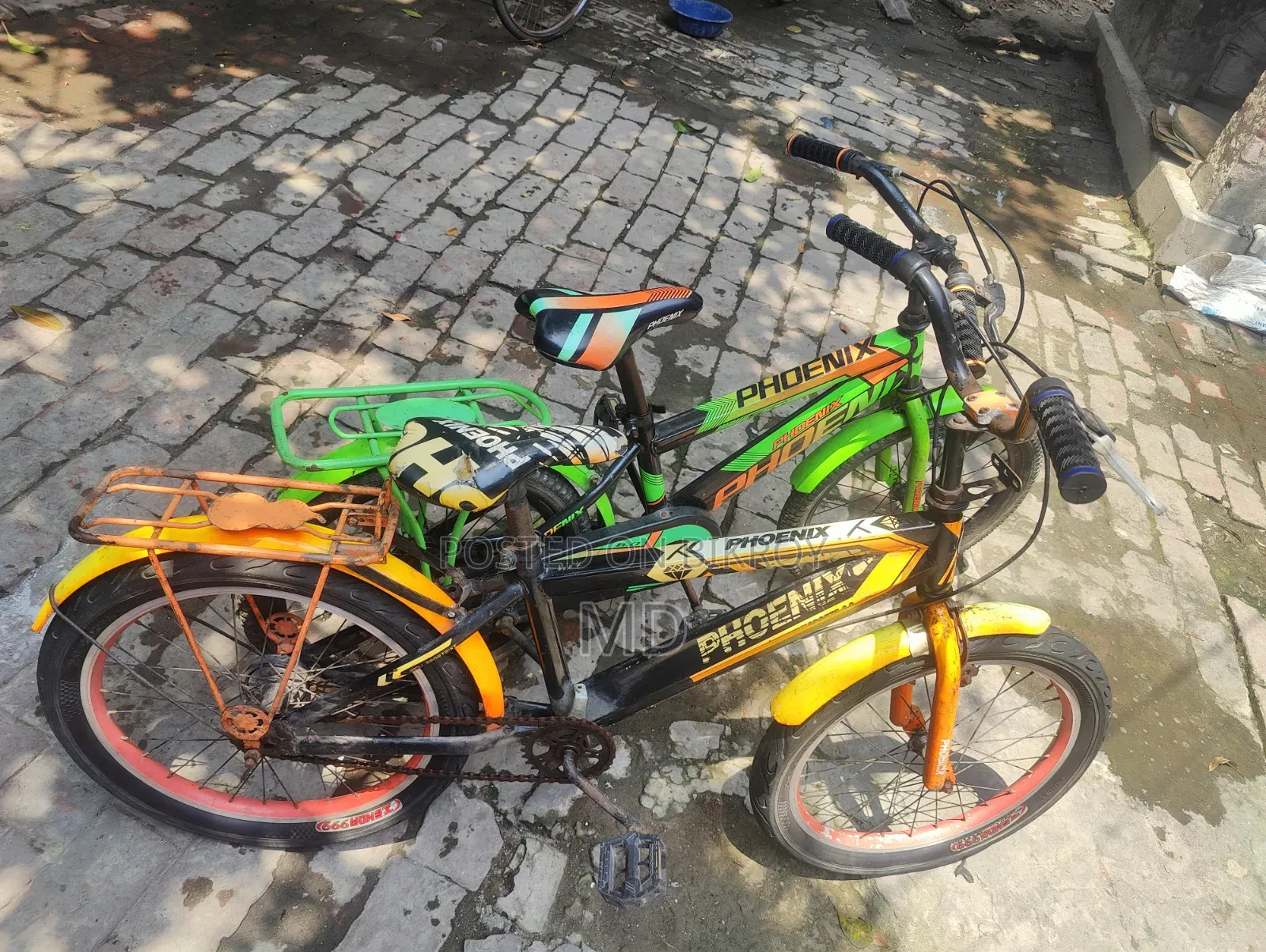 Green and Yellow Running 2 Bicycles
