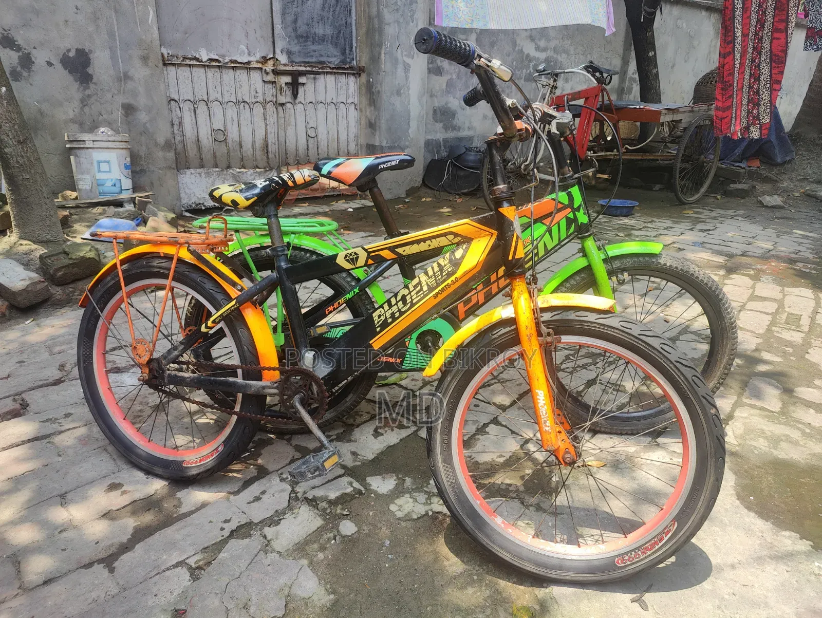 Green and Yellow Running 2 Bicycles
