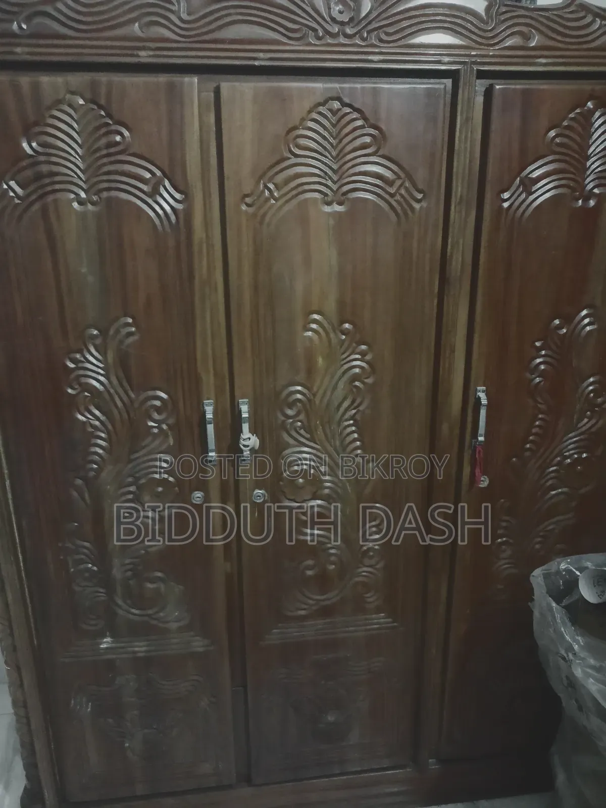 1 Mahogany wood three-door wardrobe, 1 large tin box