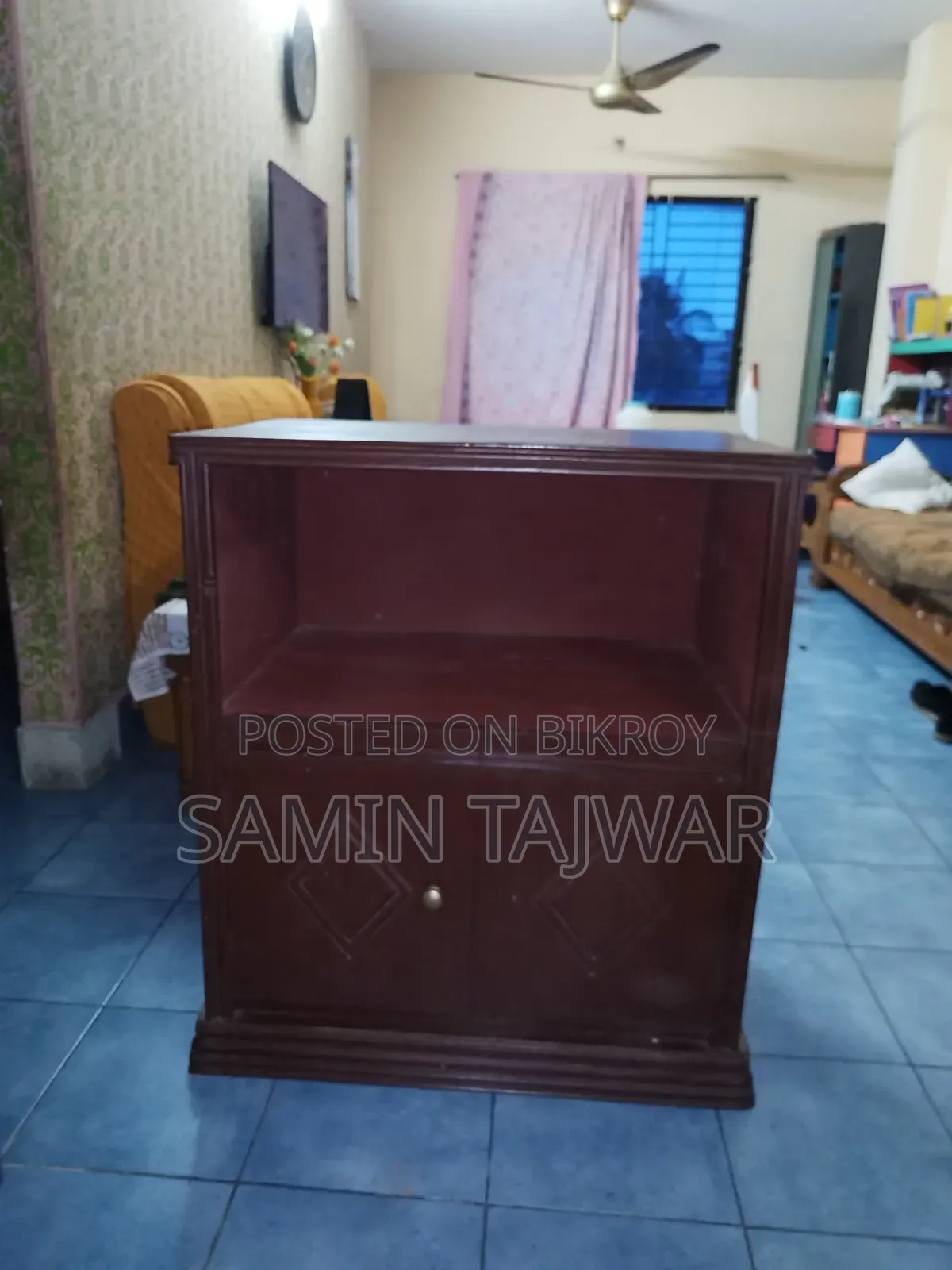 This is a wooden TV or oven table