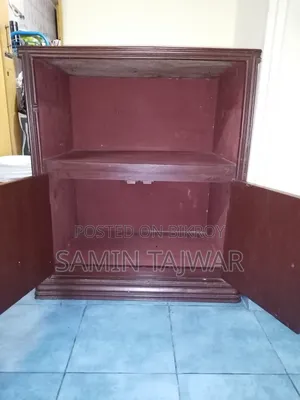 This is a wooden TV or oven table