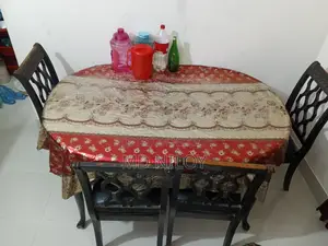 Teak wood dining table and 4 chairs for sale.