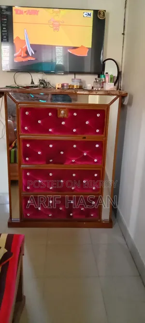 Home furniture set including a bed, cupboard, wardrobe, and dressing table