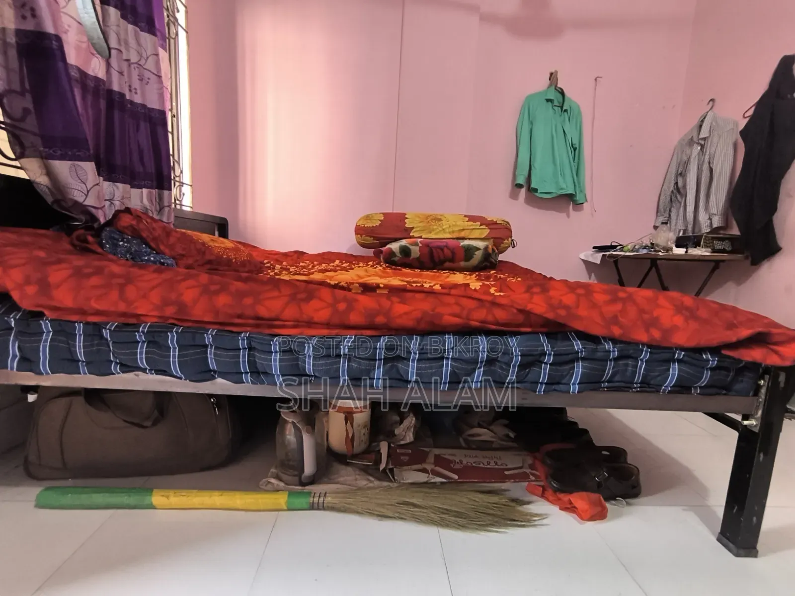 An iron bed with a mattress will be sold