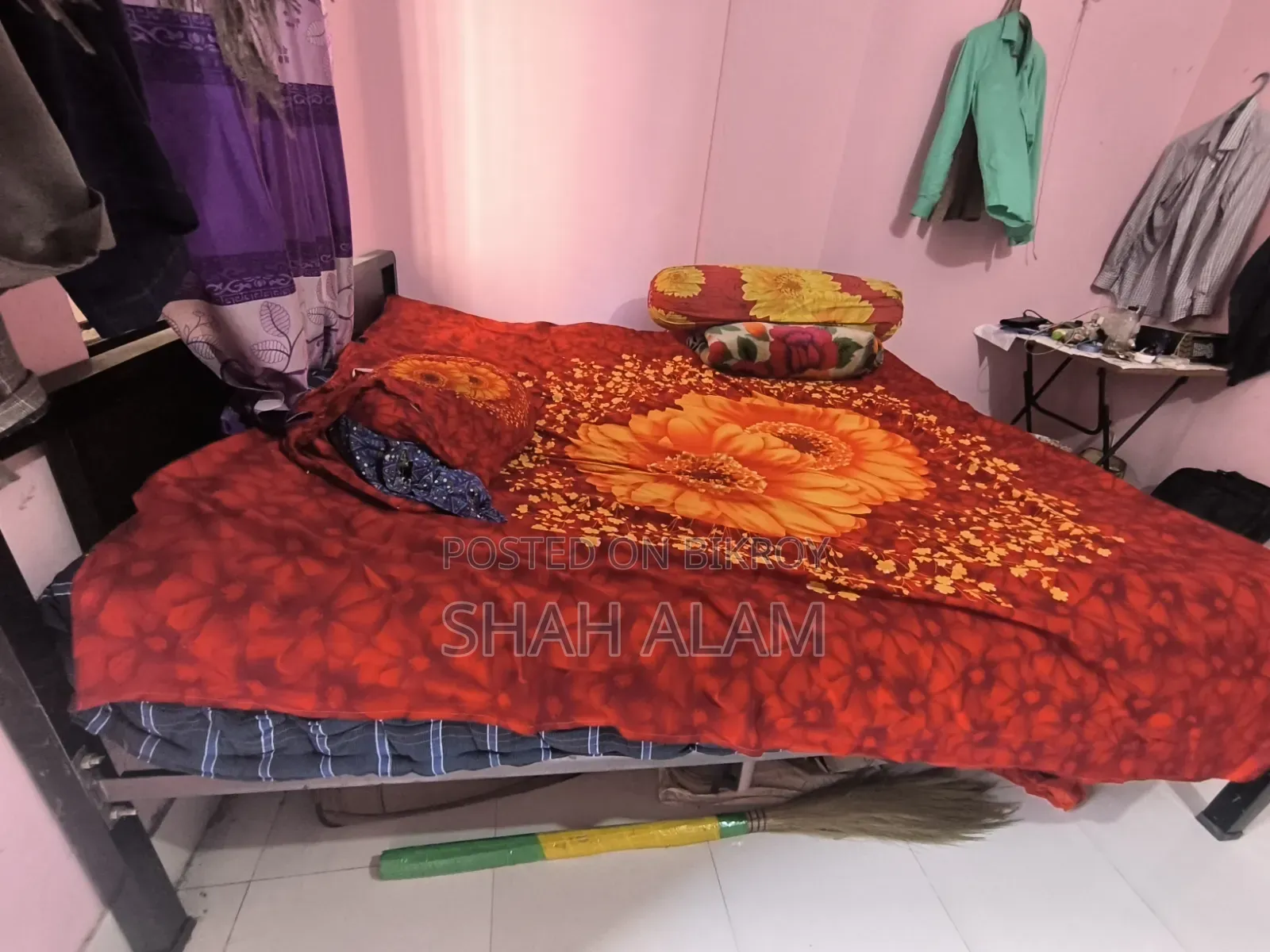An iron bed with a mattress will be sold