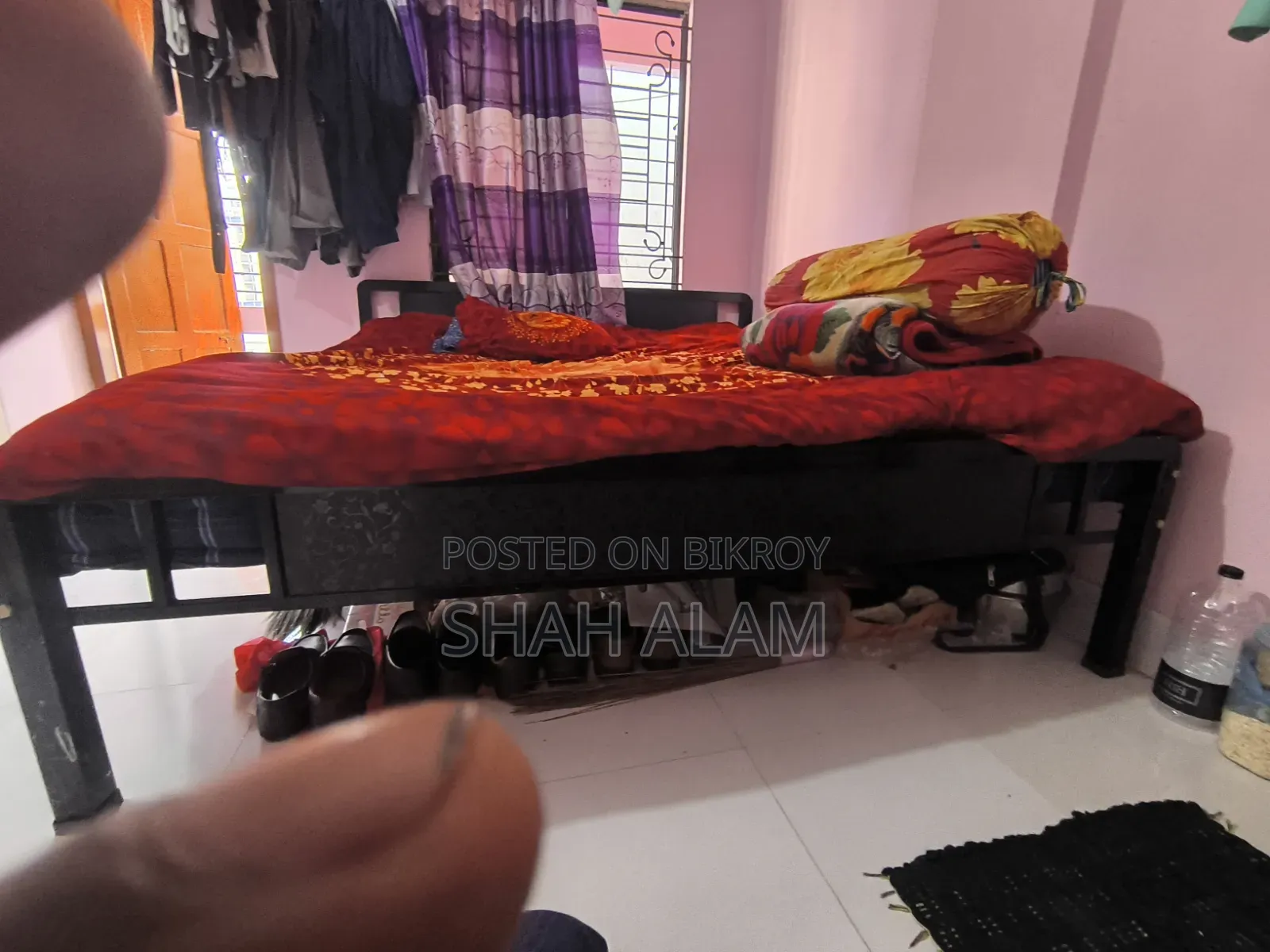 An iron bed with a mattress will be sold