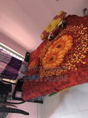 An iron bed with a mattress will be sold