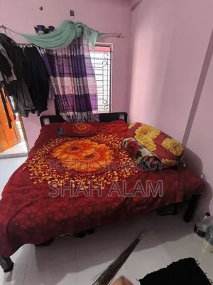 An iron bed with a mattress will be sold