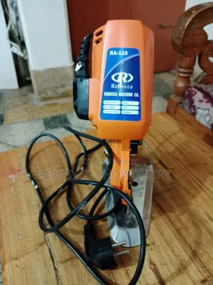 A small handheld fabric cutting machine