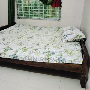 A wooden bed will be sold