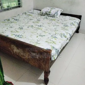 A wooden bed will be sold