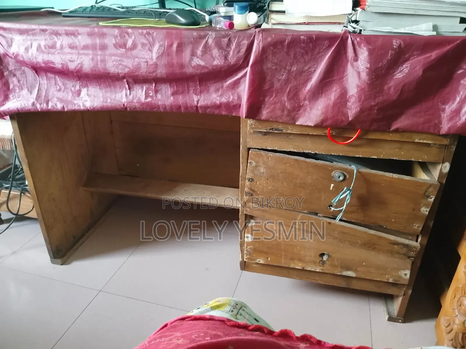 The table has slight issues with two drawers, everything else is fine. Made of Mahogany wood.
