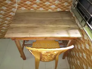 Wooden table and plastic chair purchased on 30-05-2026.