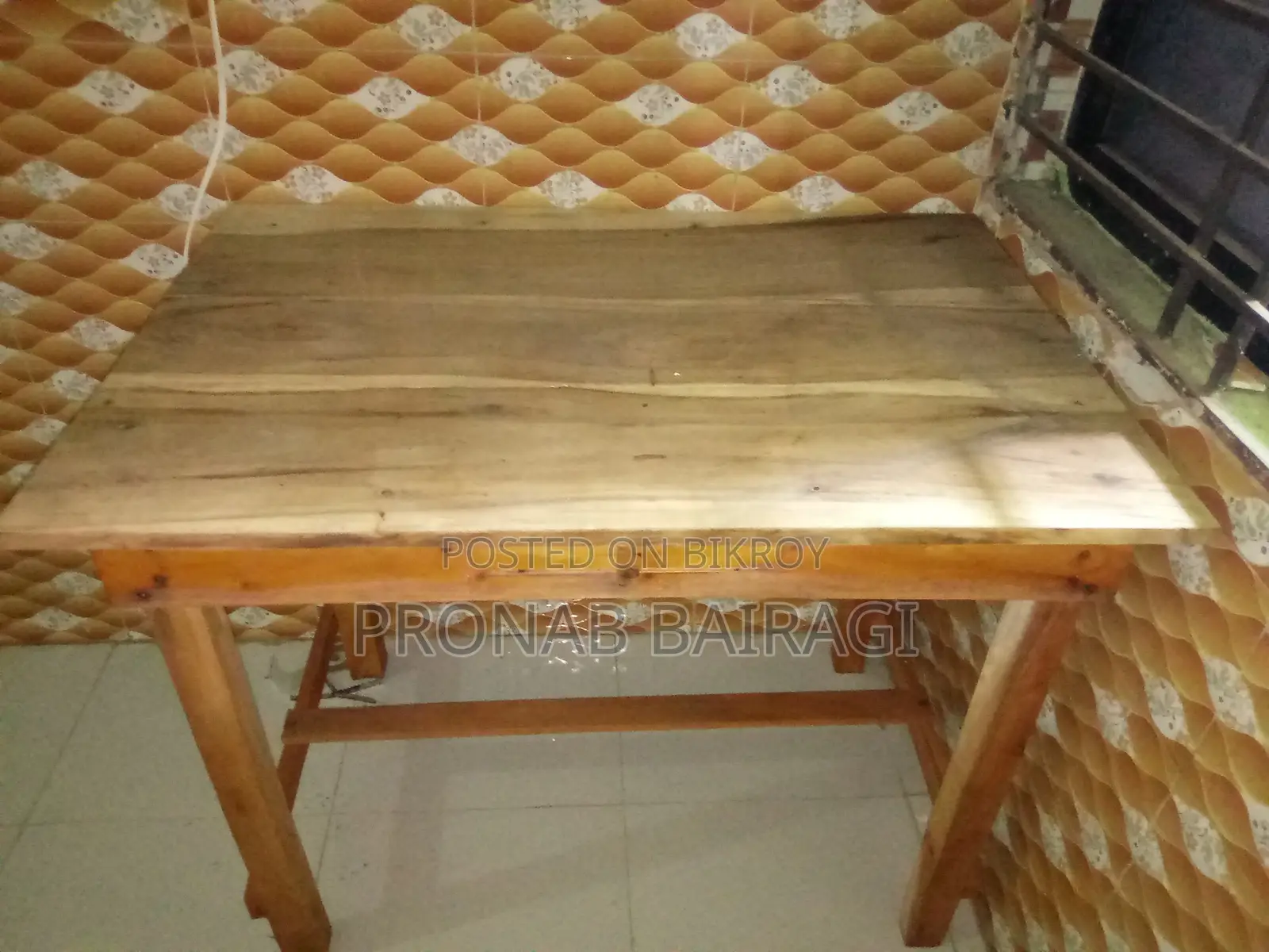 Wooden table and plastic chair purchased on 30-05-2026.