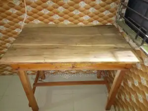 Wooden table and plastic chair purchased on 30-05-2026.