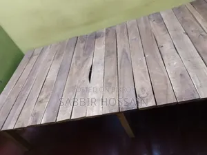 Single wooden cot and wooden table