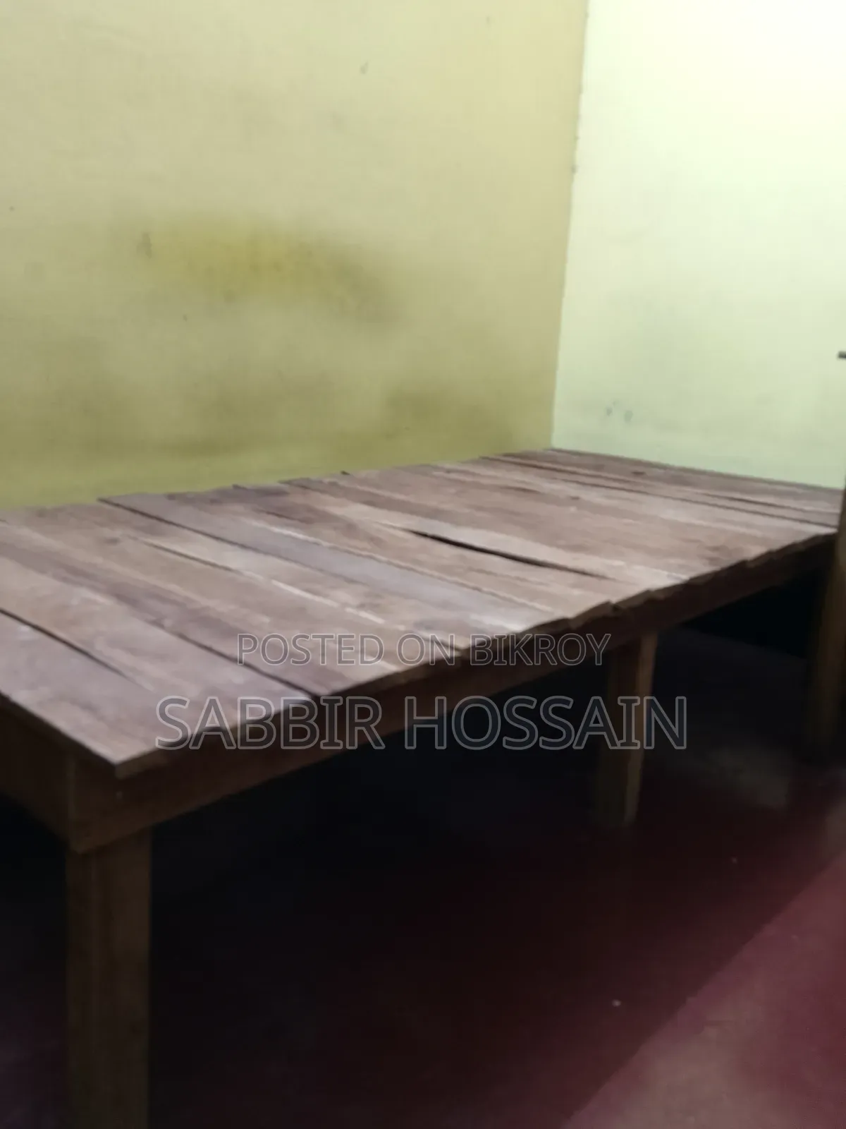 Single wooden cot and wooden table