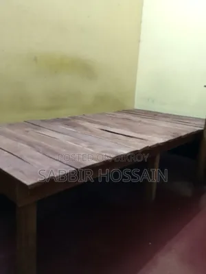 Single wooden cot and wooden table