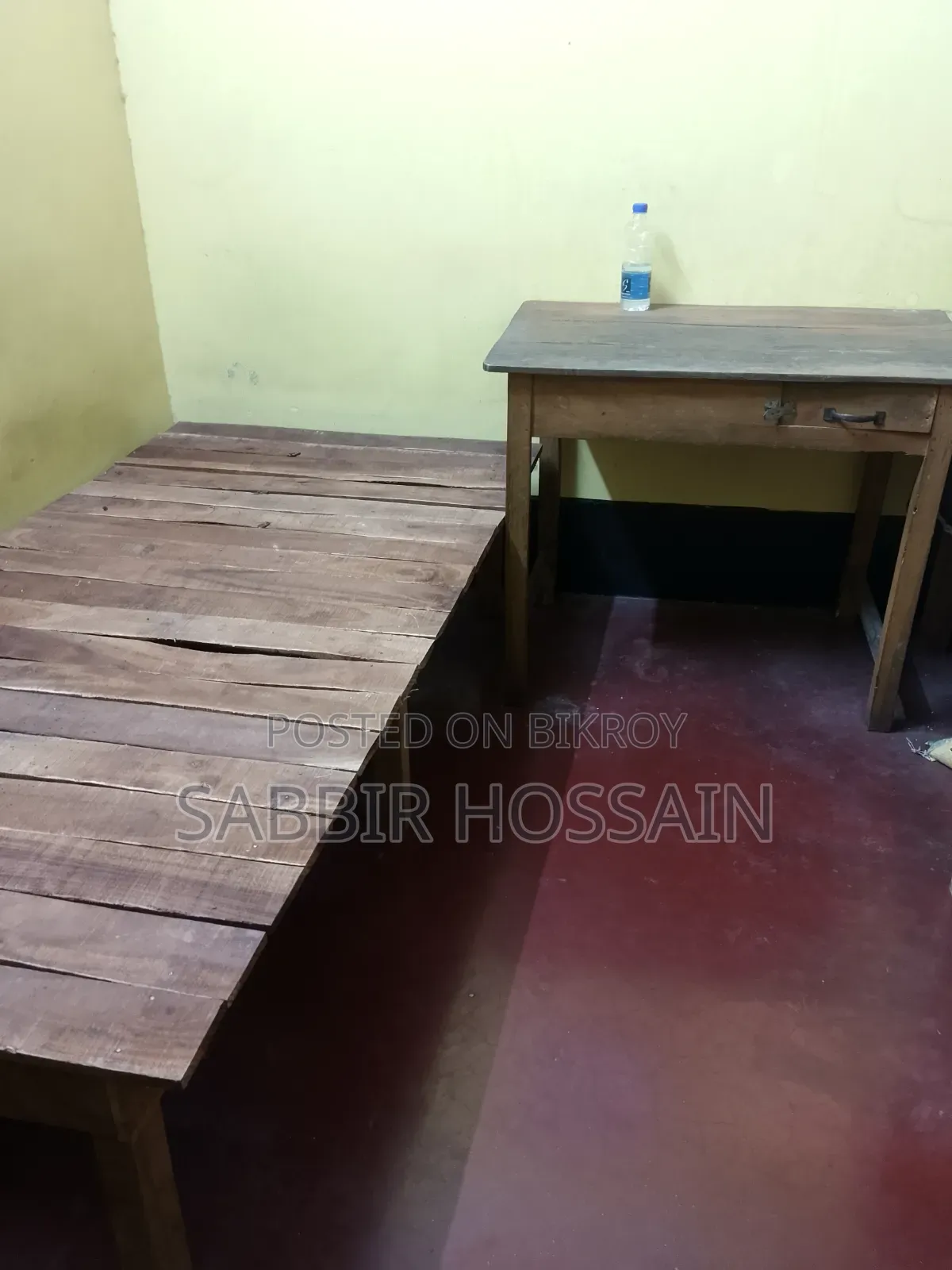 Single wooden cot and wooden table