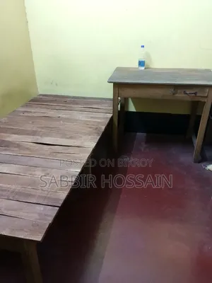 Single wooden cot and wooden table