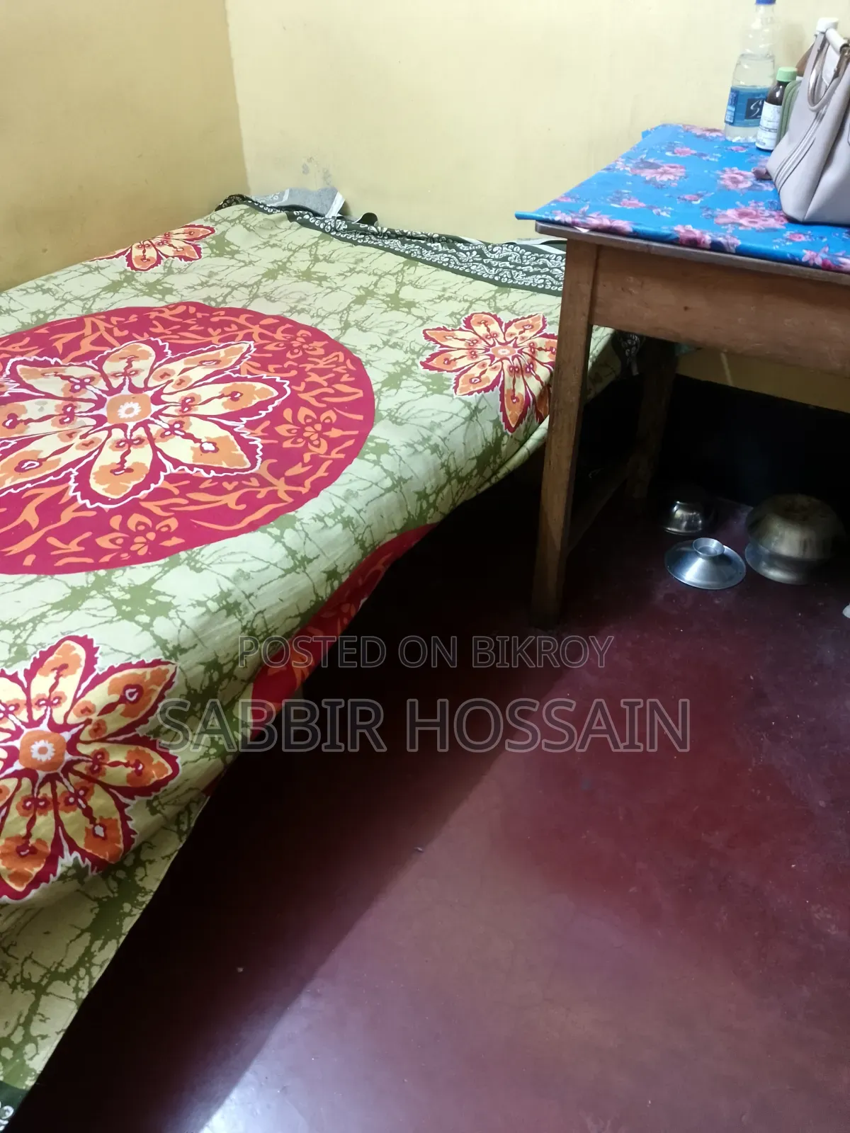 Single wooden cot and wooden table
