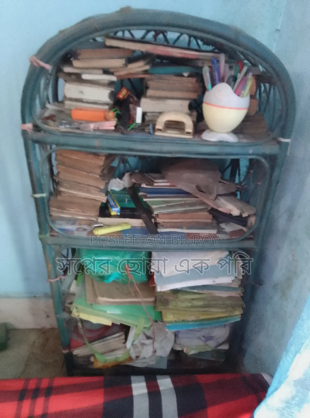 A cane bookshelf for sale.