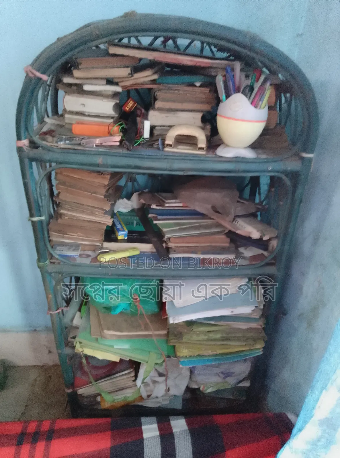 A cane bookshelf for sale.