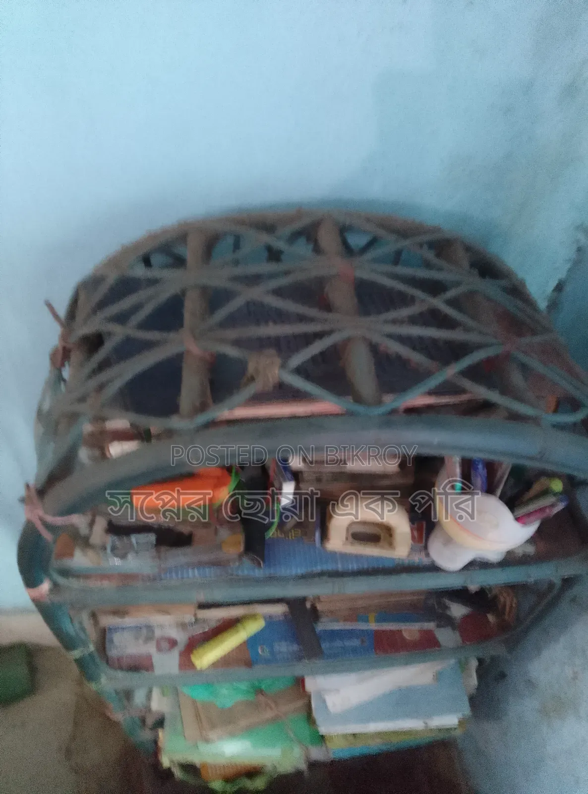 A cane bookshelf for sale.