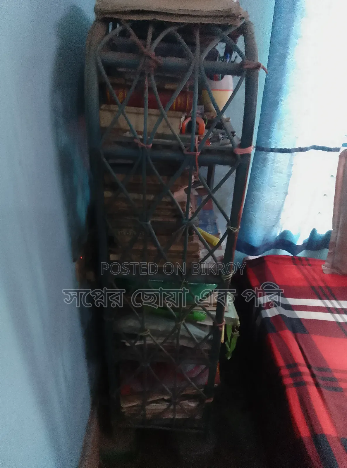 A cane bookshelf for sale.