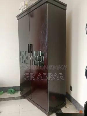 A new Malaysian wood wardrobe for sale.