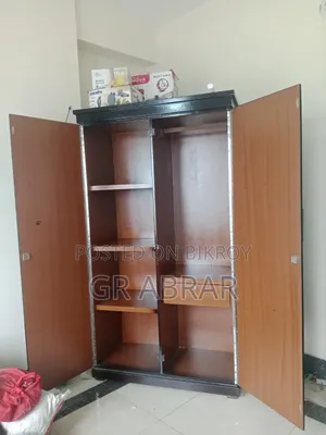 A new Malaysian wood wardrobe for sale.