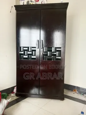 A new Malaysian wood wardrobe for sale.