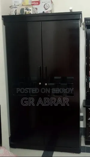 A new Malaysian wood wardrobe for sale.