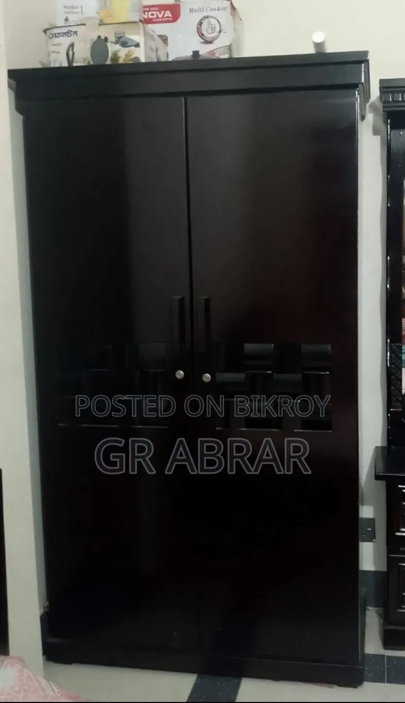 A new Malaysian wood wardrobe for sale.