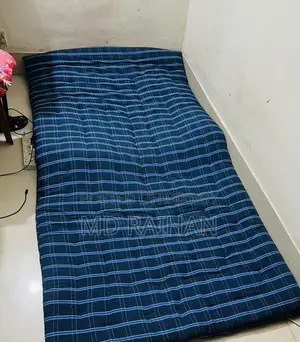 2 Used Single Bed Mattresses and 1 Bolster