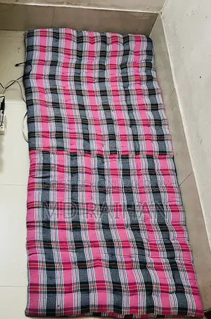 2 Used Single Bed Mattresses and 1 Bolster