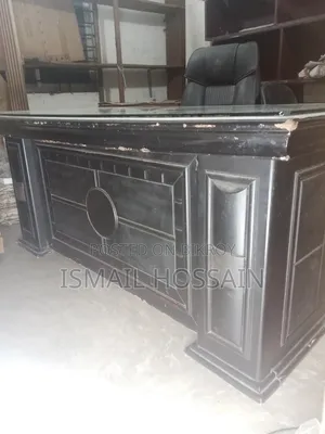 An office table 5 feet 10 inches long and 3 feet wide