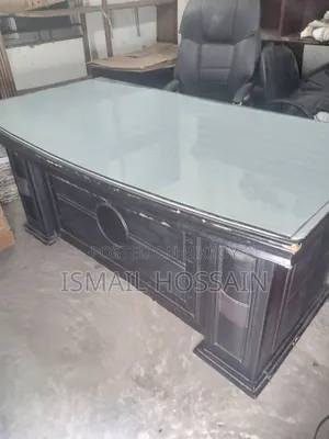 An office table 5 feet 10 inches long and 3 feet wide