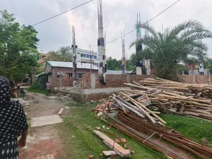 5 Katha land with six tin-shed houses for sale.