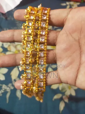 2 Pairs of Bangles and 2 Necklace Sets