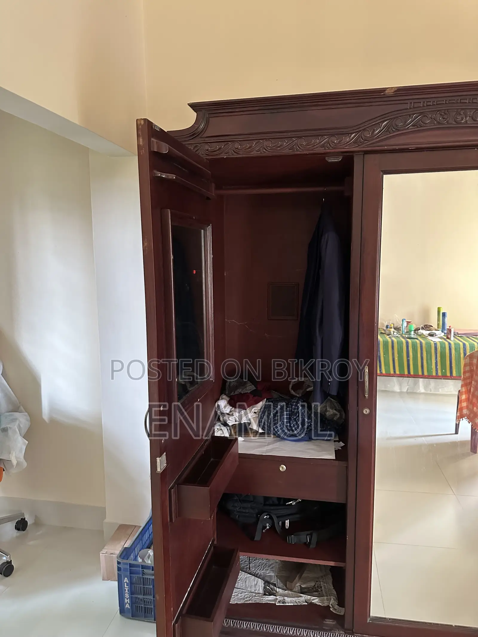 A three-door teak wood (Partex) wardrobe for sale