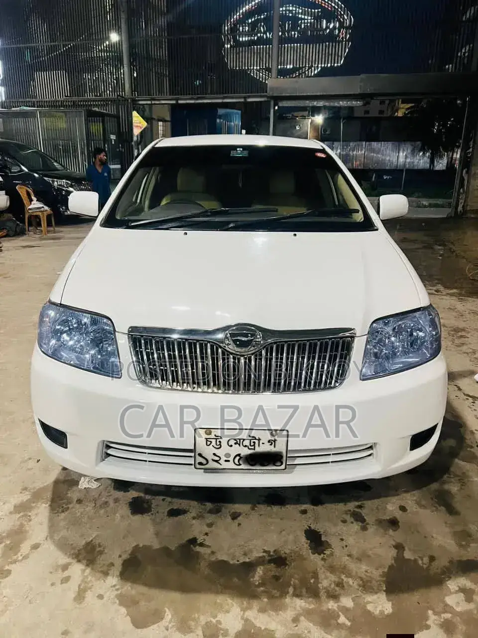 টয়োটা করোলা ২০০৫ সাদা
