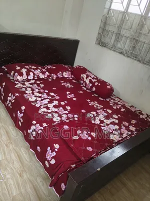 5 feet by 6 feet double Malaysian wood bed for sale, urgent