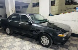 টয়োটা কারিনা ১.৫ ফ্রন্ট হুইল ড্রাইভ সেডান ১৯৯২ ধূসর