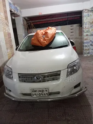 টয়োটা অ্যাক্সিও ২০০৭ সাদা