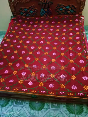 Red-Maroon Nakshi Kantha with exquisite handwork and a touch of tradition